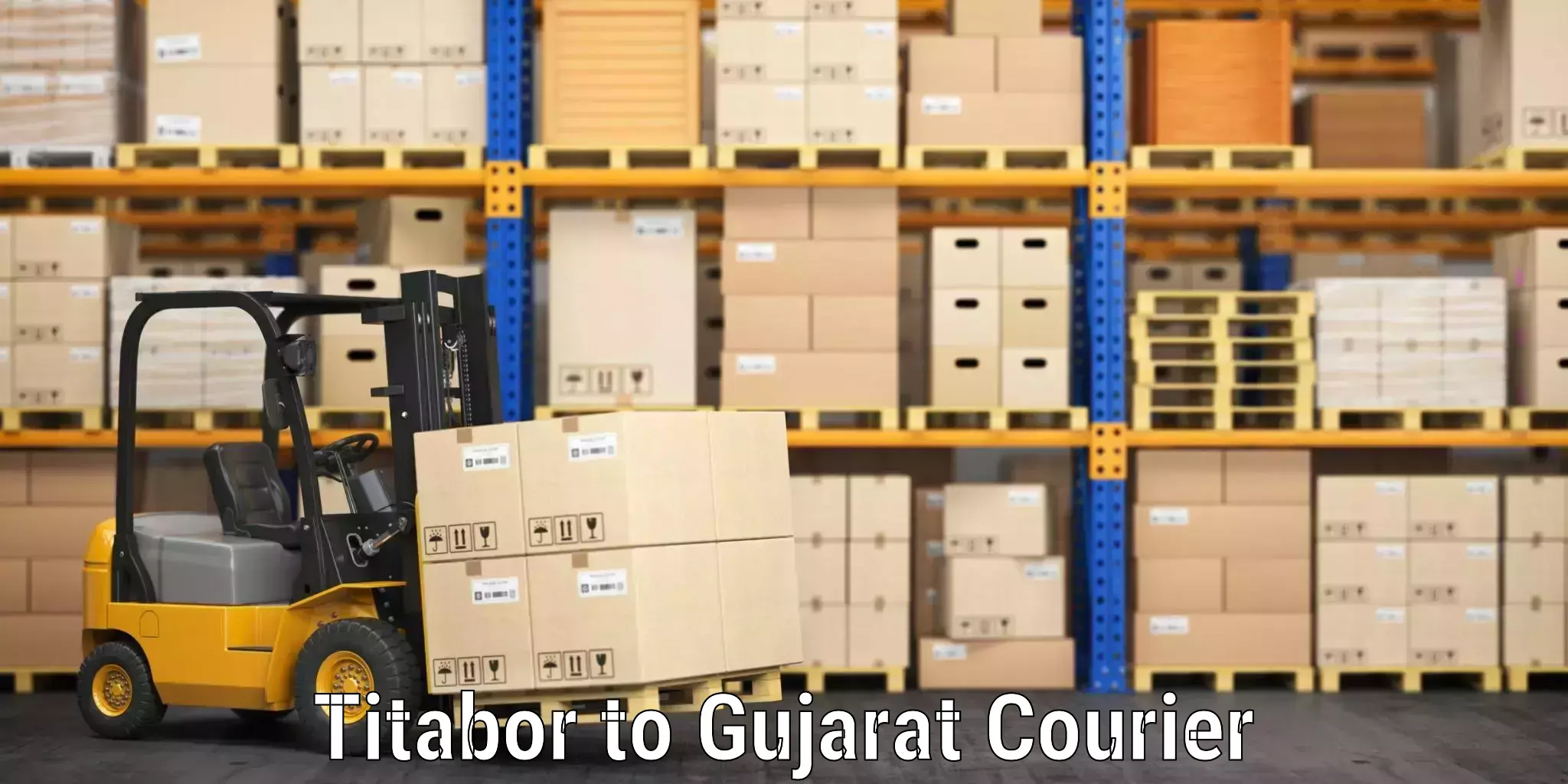 Affordable luggage courier Titabor to Dholera