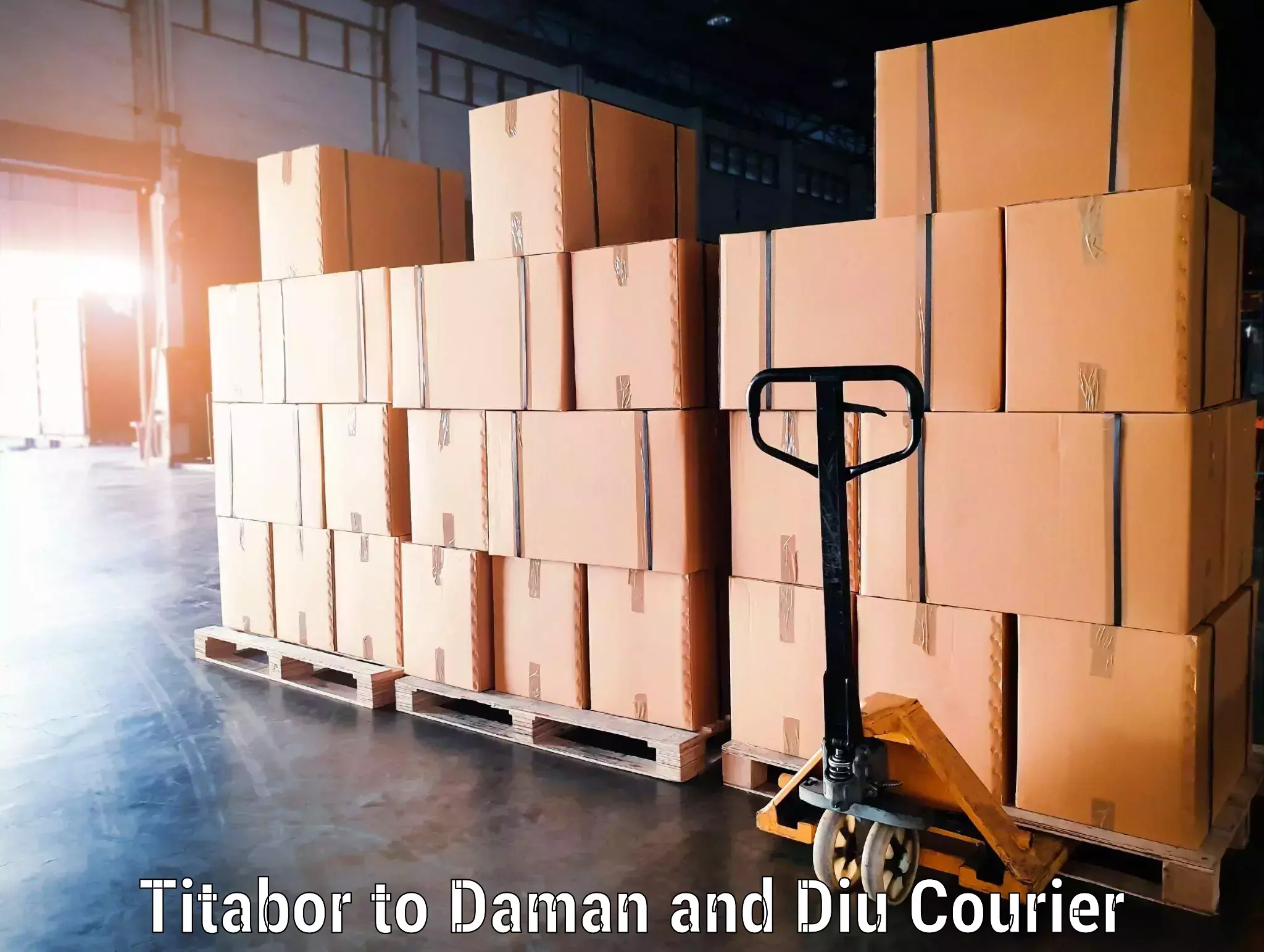 Door-to-door baggage service Titabor to Daman and Diu